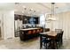 Open kitchen with stainless steel appliances, granite countertops, and seating at the kitchen island at 14344 W Hackamore Dr, Surprise, AZ 85387