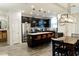 Open kitchen with stainless steel appliances, granite countertops, and seating at the island at 14344 W Hackamore Dr, Surprise, AZ 85387