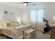 Serene bedroom featuring soft neutral tones, a plush bed, and ample natural light at 14344 W Hackamore Dr, Surprise, AZ 85387