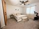 Bright bedroom with a ceiling fan, a peloton bike, and neutral decor at 14344 W Hackamore Dr, Surprise, AZ 85387