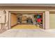 Spacious garage with ample storage and organization, perfect for hobbies and projects at 14426 W Becker Ln, Surprise, AZ 85379