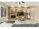Inviting living room featuring a custom media center, neutral tones, and plush seating at 14426 W Becker Ln, Surprise, AZ 85379