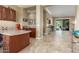 This office features custom wood cabinets, granite counters, tile floors, and easy access to the backyard patio at 14426 W Becker Ln, Surprise, AZ 85379