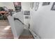 Interior staircase with industrial handrail, plush carpet, and lift chair at 14426 W Becker Ln, Surprise, AZ 85379