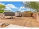 Spacious backyard with gravel and multiple outbuildings at 14426 W Becker Ln, Surprise, AZ 85379