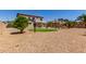 Large backyard with artificial grass, a pool, and ample space for entertaining at 15683 W Minnezona Ave, Goodyear, AZ 85395
