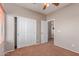 Bedroom with large closet, plush carpet and view to other rooms in the house at 15683 W Minnezona Ave, Goodyear, AZ 85395