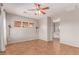 Spacious bedroom with neutral walls, tile floor, ceiling fan, and window blinds at 15683 W Minnezona Ave, Goodyear, AZ 85395