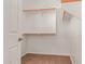 Walk-in closet with built-in shelving and storage space; well-organized at 15683 W Minnezona Ave, Goodyear, AZ 85395