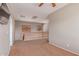 Loft area with neutral carpeting, wood railing, and two windows with blinds at 15683 W Minnezona Ave, Goodyear, AZ 85395