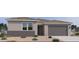 Charming single-story home with a two-car garage and low-maintenance desert landscaping at 15734 W Brown St, Waddell, AZ 85355