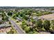 An aerial view of the residential neighborhood showcases lush landscaping and tree-lined streets on a sunny day at 1720 W Elm St, Phoenix, AZ 85015