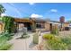 Inviting backyard with a pergola, fountain, lush vegetation, and outdoor seating area at 1720 W Elm St, Phoenix, AZ 85015