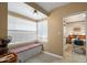 Bright breakfast nook features a cozy bench seat by the window, with natural light and tile flooring at 1720 W Elm St, Phoenix, AZ 85015