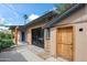 Side exterior of the home with access to the backyard and multiple entry points at 1720 W Elm St, Phoenix, AZ 85015
