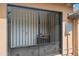 Black iron gate in stucco wall with decorative trim and gate hardware at 1720 W Elm St, Phoenix, AZ 85015