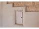A beige exterior wall with a Dura-box access panel, showcasing unique architectural details at 1720 W Elm St, Phoenix, AZ 85015