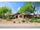 Charming home boasting lush desert landscaping and a mature shade tree at 1720 W Elm St, Phoenix, AZ 85015