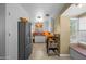 Well-lit kitchen features a stainless steel refrigerator, adjacent to a cozy breakfast nook at 1720 W Elm St, Phoenix, AZ 85015