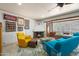 Cozy living room featuring a fireplace, comfortable seating, and unique wall decor, creating a welcoming space at 1720 W Elm St, Phoenix, AZ 85015