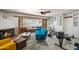 Relaxing living room boasts ample natural light, a fireplace, and modern exercise equipment, perfect for an active lifestyle at 1720 W Elm St, Phoenix, AZ 85015