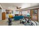 A well-lit living room with a fireplace, cozy seating, and unique decor creates an inviting atmosphere for relaxation at 1720 W Elm St, Phoenix, AZ 85015