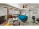 This stylish living room featuring a fireplace, window seat, and fitness equipment offers a versatile living space at 1720 W Elm St, Phoenix, AZ 85015