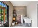 Workshop with a concrete block wall, utility sink, and exterior access door at 1720 W Elm St, Phoenix, AZ 85015