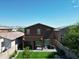 A landscaped backyard boasts a cozy patio with green lawn, ideal for outdoor living and entertaining at 20217 W Desert Bloom St, Buckeye, AZ 85326