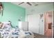Bright bedroom with light walls, carpet floors, white trim and doors, and ample natural light at 20217 W Desert Bloom St, Buckeye, AZ 85326
