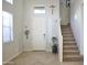 Inviting foyer showcasing the staircase, neutral walls, and tile flooring at 20217 W Desert Bloom St, Buckeye, AZ 85326