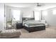 Spacious main bedroom with large windows, light walls, carpet floors, and a ceiling fan at 20217 W Desert Bloom St, Buckeye, AZ 85326