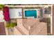 Backyard showcasing a pool, lounge area, outdoor kitchen, basketball court, and colorful flowers at 20532 W Summit Pl, Buckeye, AZ 85396