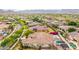 Stunning aerial view of a home with pool and desert landscape with solar panels and mountain views at 20532 W Summit Pl, Buckeye, AZ 85396