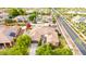 Lovely aerial view of a home with a tile roof in a beautiful neighborhood with lush landscaping and solar panels at 20532 W Summit Pl, Buckeye, AZ 85396