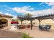 Expansive backyard featuring a full outdoor kitchen, dining area, lounge seating, and sparkling pool, perfect for entertaining at 20532 W Summit Pl, Buckeye, AZ 85396