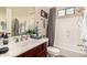 Bathroom with updated fixtures, vanity, and shower and tub combination at 20532 W Summit Pl, Buckeye, AZ 85396