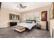 Serene bedroom featuring a ceiling fan, neutral walls, and large windows for natural light at 20532 W Summit Pl, Buckeye, AZ 85396