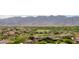 Scenic community view overlooking a golf course, surrounded by mountains, homes and beautiful desert vegetation at 20532 W Summit Pl, Buckeye, AZ 85396