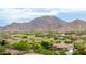 Scenic community view overlooking a golf course, surrounded by mountains, homes and beautiful desert vegetation at 20532 W Summit Pl, Buckeye, AZ 85396