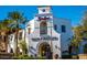 Charming Main St Market featuring retail and dining set amidst manicured landscaping and palm trees at 20532 W Summit Pl, Buckeye, AZ 85396