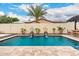 Backyard pool featuring lovely fountains and decor to make it feel like home at 20532 W Summit Pl, Buckeye, AZ 85396