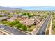 Aerial view showcasing a neighborhood with beautiful homes, landscaping, and mountain backdrop at 20532 W Summit Pl, Buckeye, AZ 85396