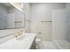 Charming bathroom featuring a modern vanity, decorative mirror, and tiled shower at 210 E Cactus Wren Dr, Phoenix, AZ 85020
