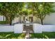 Charming courtyard seating area surrounded by lush trees, creating a serene outdoor space at 210 E Cactus Wren Dr, Phoenix, AZ 85020