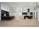 Large open kitchen featuring dark cabinetry, hardwood floors, modern lighting, and an oversized island at 210 E Cactus Wren Dr, Phoenix, AZ 85020