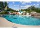 Backyard swimming pool featuring rock waterfall, water slide, and ample space for entertaining at 210 E Cactus Wren Dr, Phoenix, AZ 85020