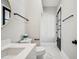 Elegant powder room features modern fixtures, marble floors, and a stylish round mirror at 210 E Cactus Wren Dr, Phoenix, AZ 85020