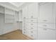A spacious walk-in closet with custom shelving and ample storage space at 210 E Cactus Wren Dr, Phoenix, AZ 85020