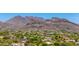 Expansive aerial view of a picturesque neighborhood nestled among verdant trees and majestic mountain views at 22050 N 90Th St, Scottsdale, AZ 85255